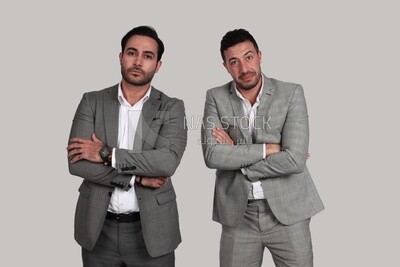 Photo of two men standing together with crossed hands, discussing work, business development and partnerships, business meeting, Model