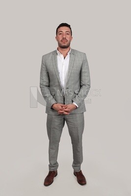 Photo of a businessman with a formal suit standing on a white background, business development and partnerships, business meeting, Model