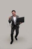 Photo of a businessman with a formal suit holding a laptop, business development and partnerships, business meeting, Model