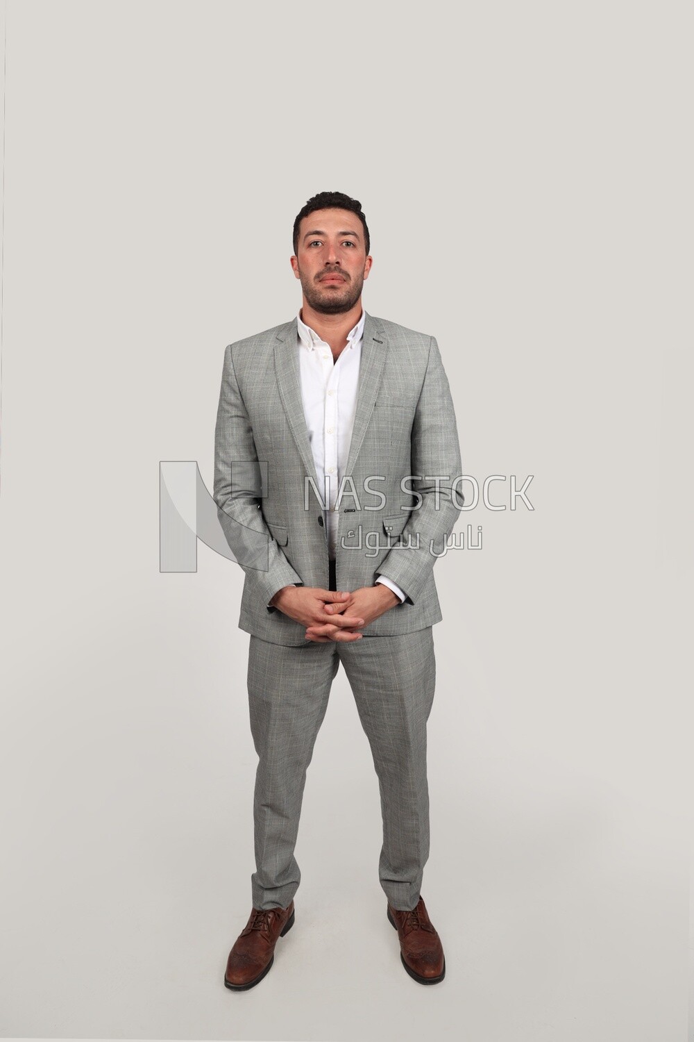 Photo of a businessman with a formal suit standing on a white background, business development and partnerships, business meeting, Model