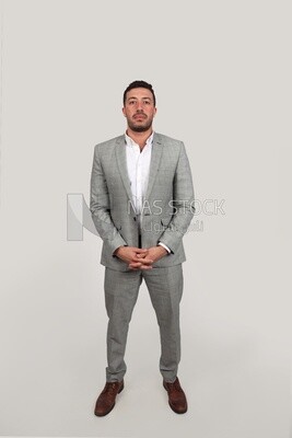 Photo of a businessman with a formal suit standing on a white background, business development and partnerships, business meeting, Model