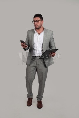 Photo of a businessman in a business suit checking documents, business development and partnerships, business meetings, models