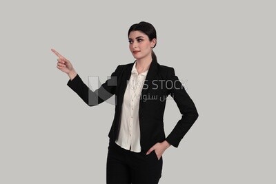 Photo of a businesswoman in formal wear standing pointing away, business development and partnerships, business meeting, Model