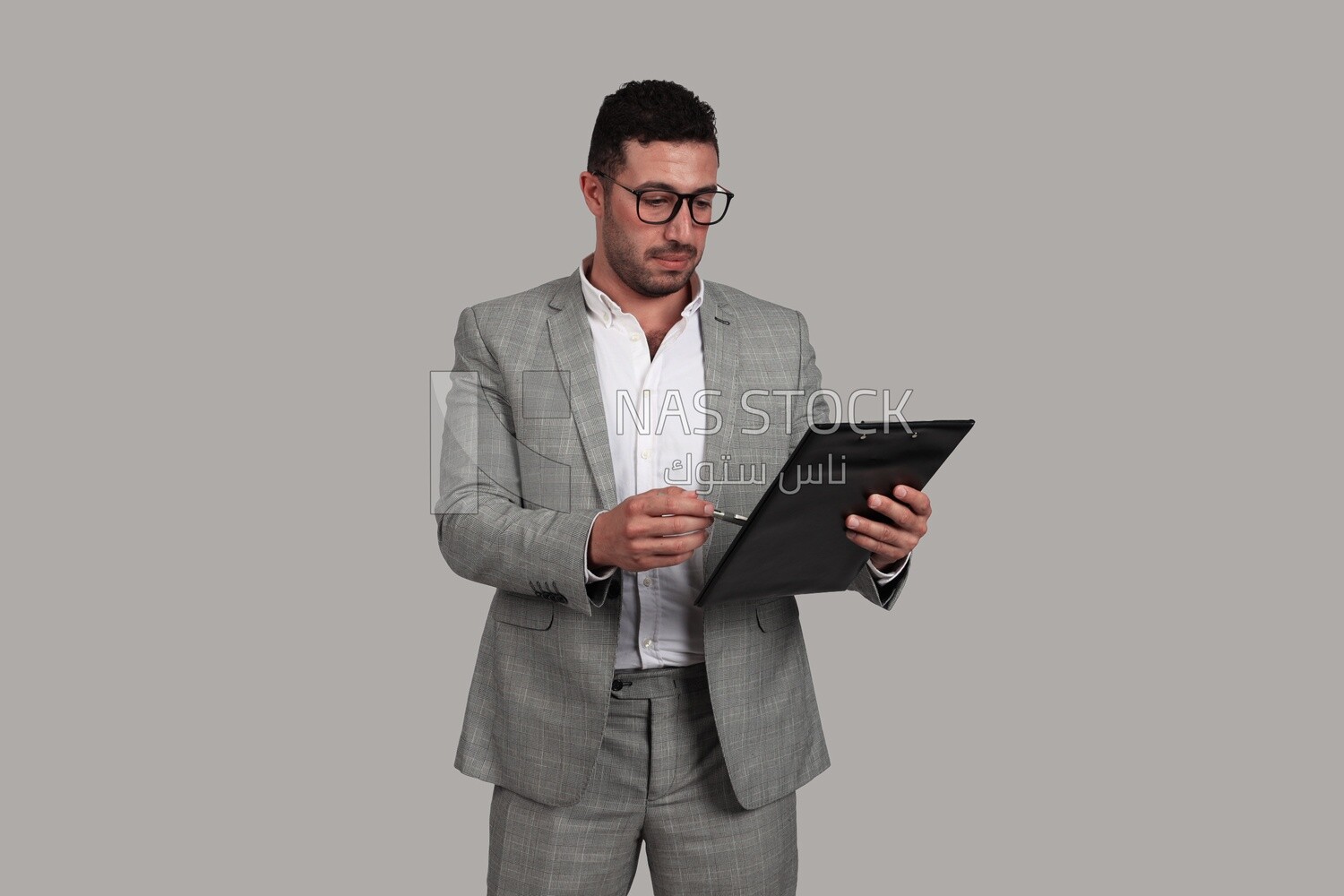 Photo of a businessman in a business suit checking documents, business development and partnerships, business meetings, models