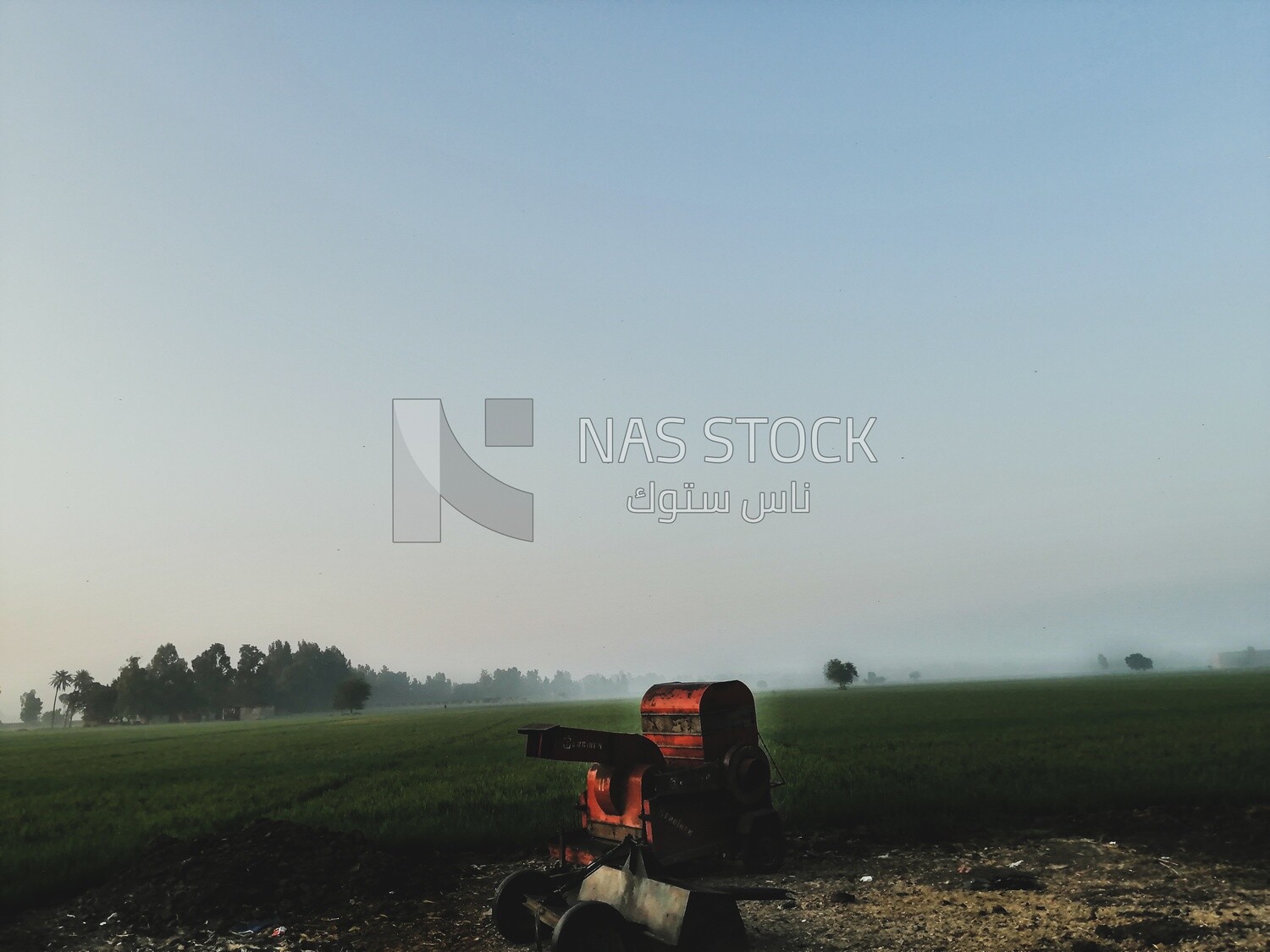 Agricultural machine, farm trees, and green plants, farm fields, trees and crops, farmland, a scenic landscape