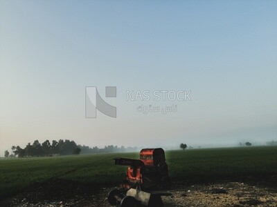 Agricultural machine, farm trees, and green plants, farm fields, trees and crops, farmland, a scenic landscape