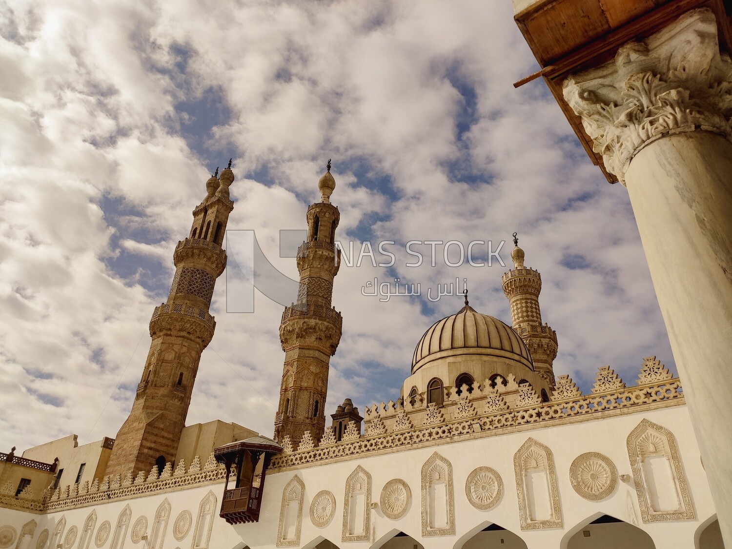 Stunning view of the sky full of clouds above the minaret and courtyard of Al-Azhar Mosque