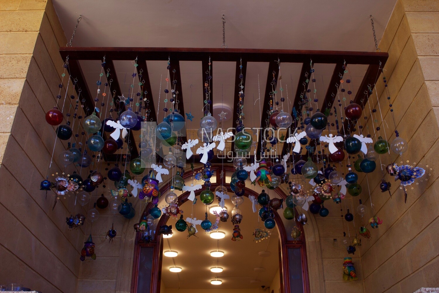 Collection of hanging ceramic decorations and macrames in one of the ceramic workshops