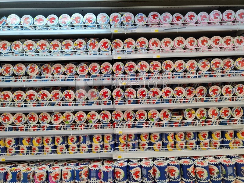 Shelves stacked with types of cheese