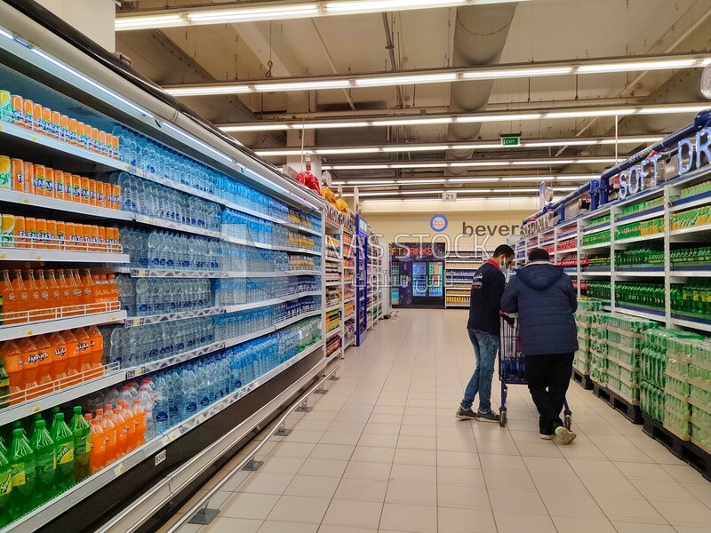 Workers arrange goods in shelves