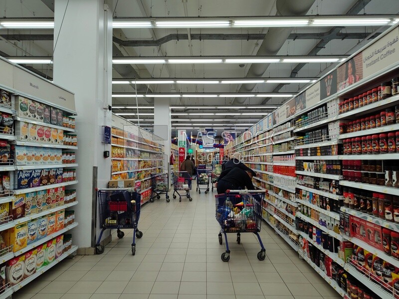 Customers shopping inside beverage section