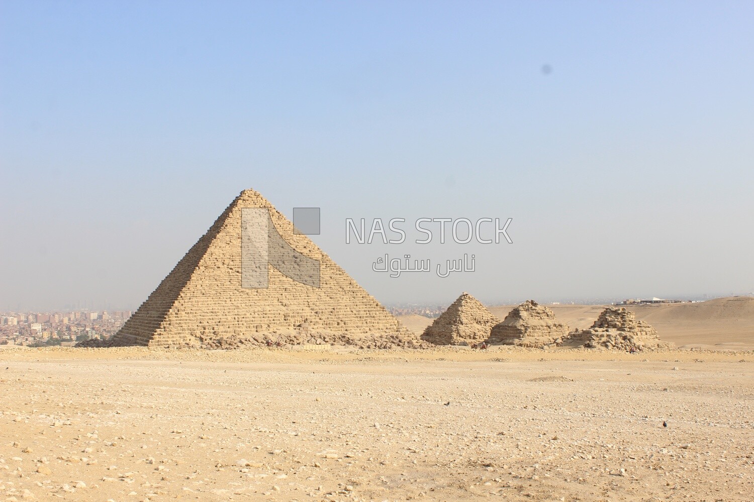 One of the pyramids of Giza, next to a small group of pyramids​