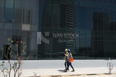 Engineers working in a building site at the new administrative capital, construction