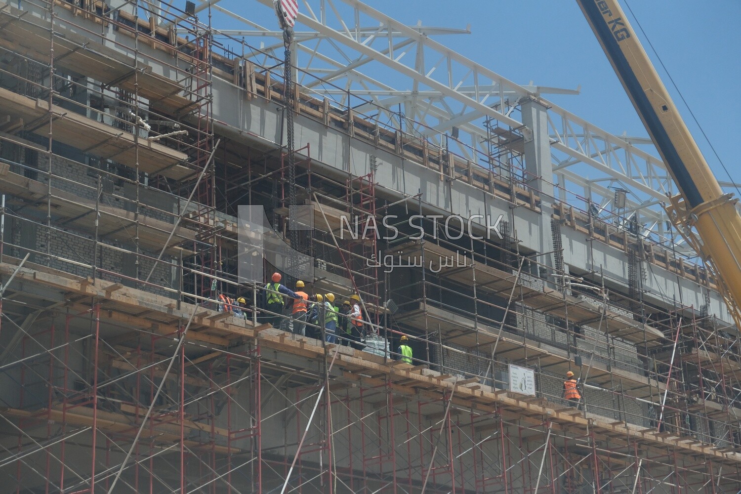Engineers working in a building site at the new administrative capital, construction