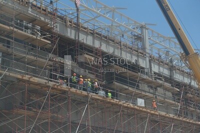 Engineers working in a building site at the new administrative capital, construction