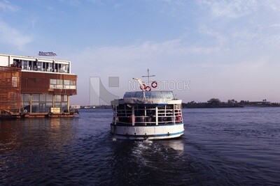 Small ferry boat with people crossing the river, crossing river, calm river, landscapes, ships and fishing boats, nature background