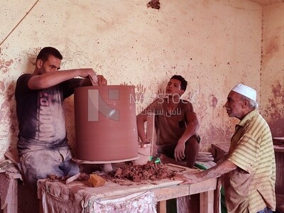Men working in a pottery workshop