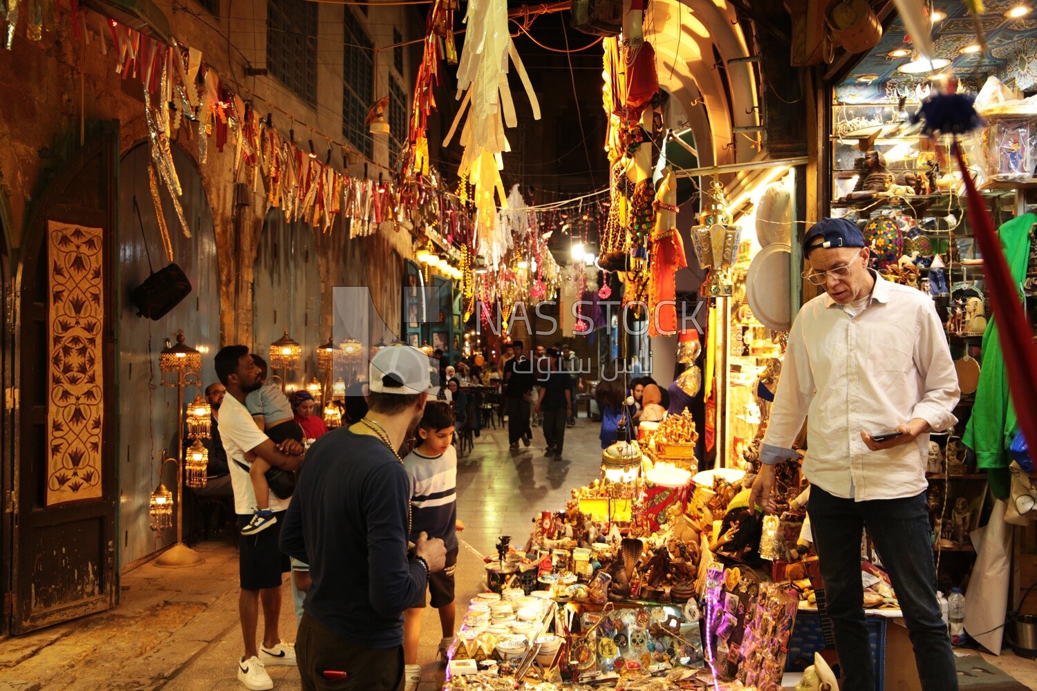 Night view of a street full of people during Ramadan, worship and drawing close to God