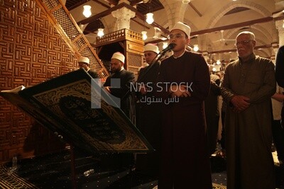 Worshipers praying in a mosque, performing the obligatory prayer in the mosque, worship and draw close to God