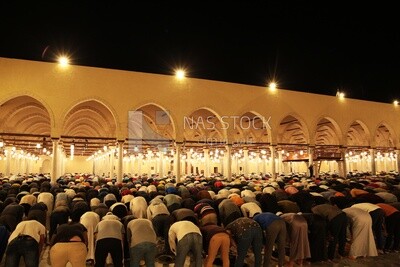 View from the back of the worshipers in the mosque, performing the obligatory prayer inside the mosque, reverence in prayer, performing the obligatory prayer in the mosque, worship and getting closer