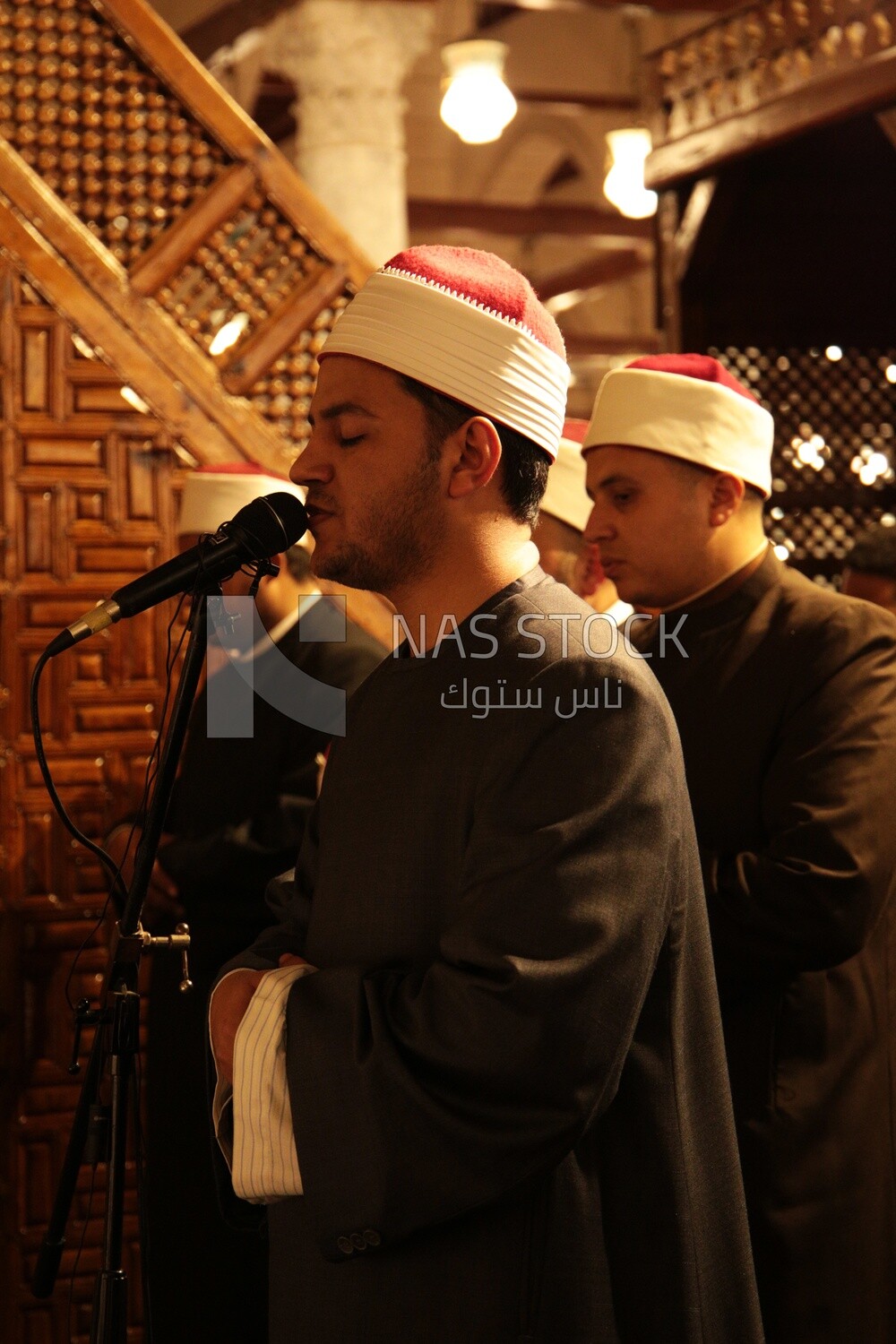 Imam of the mosque praying with people Worshipers praying in a mosque, performing the obligatory prayer in the mosque, worship and draw close to God