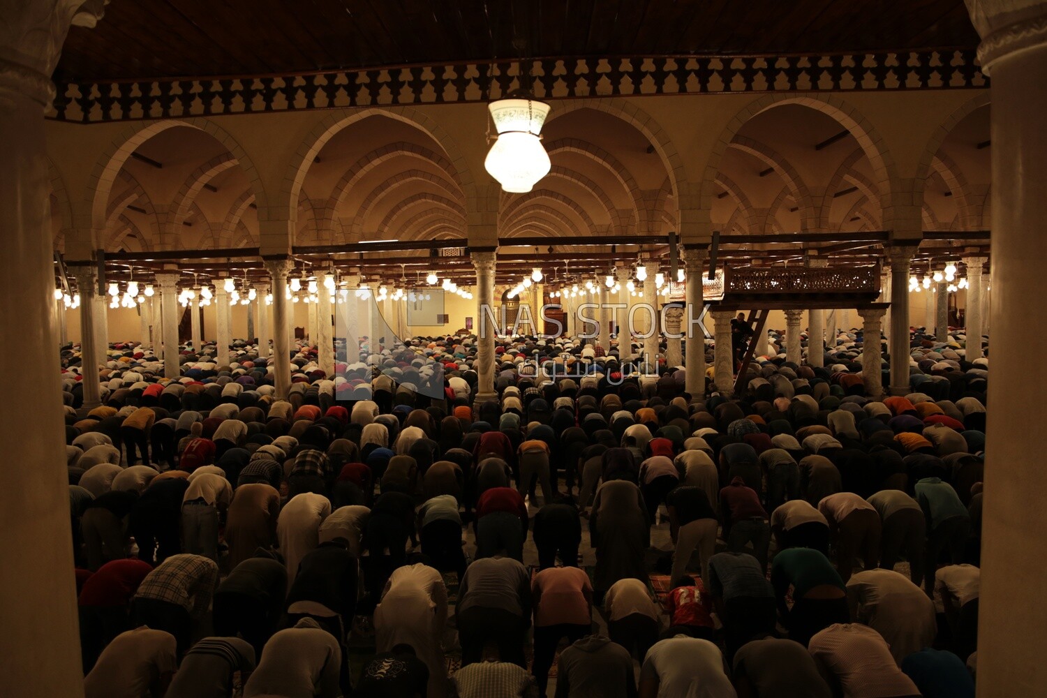 View from the back of the worshipers in the mosque, performing the obligatory prayer inside the mosque, reverence in prayer, performing the obligatory prayer in the mosque, worship and getting closer