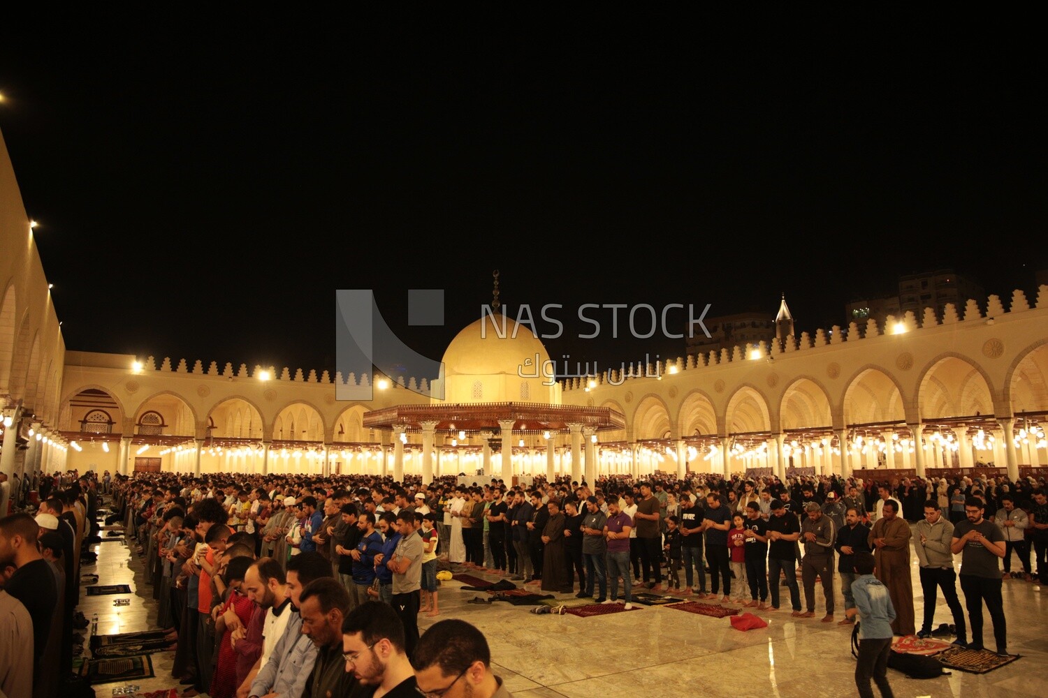 Worshipers praying in a mosque, performing the obligatory prayer in the mosque, worship and draw close to God