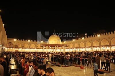 Worshipers praying in a mosque, performing the obligatory prayer in the mosque, worship and draw close to God