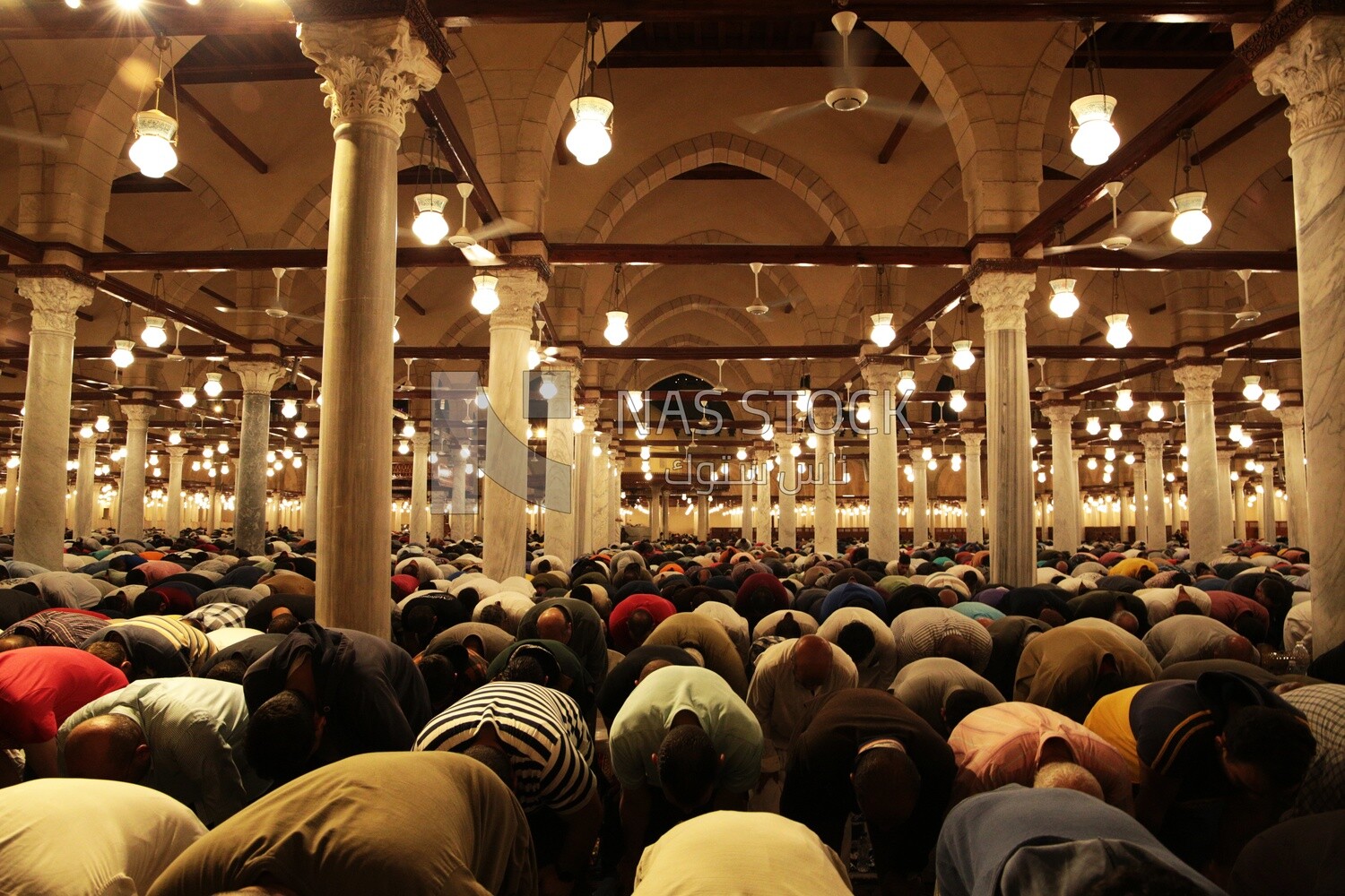 Worshipers praying in a mosque, performing the obligatory prayer in the mosque, worship and draw close to God