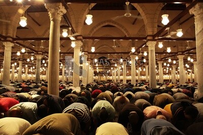 Worshipers praying in a mosque, performing the obligatory prayer in the mosque, worship and draw close to God
