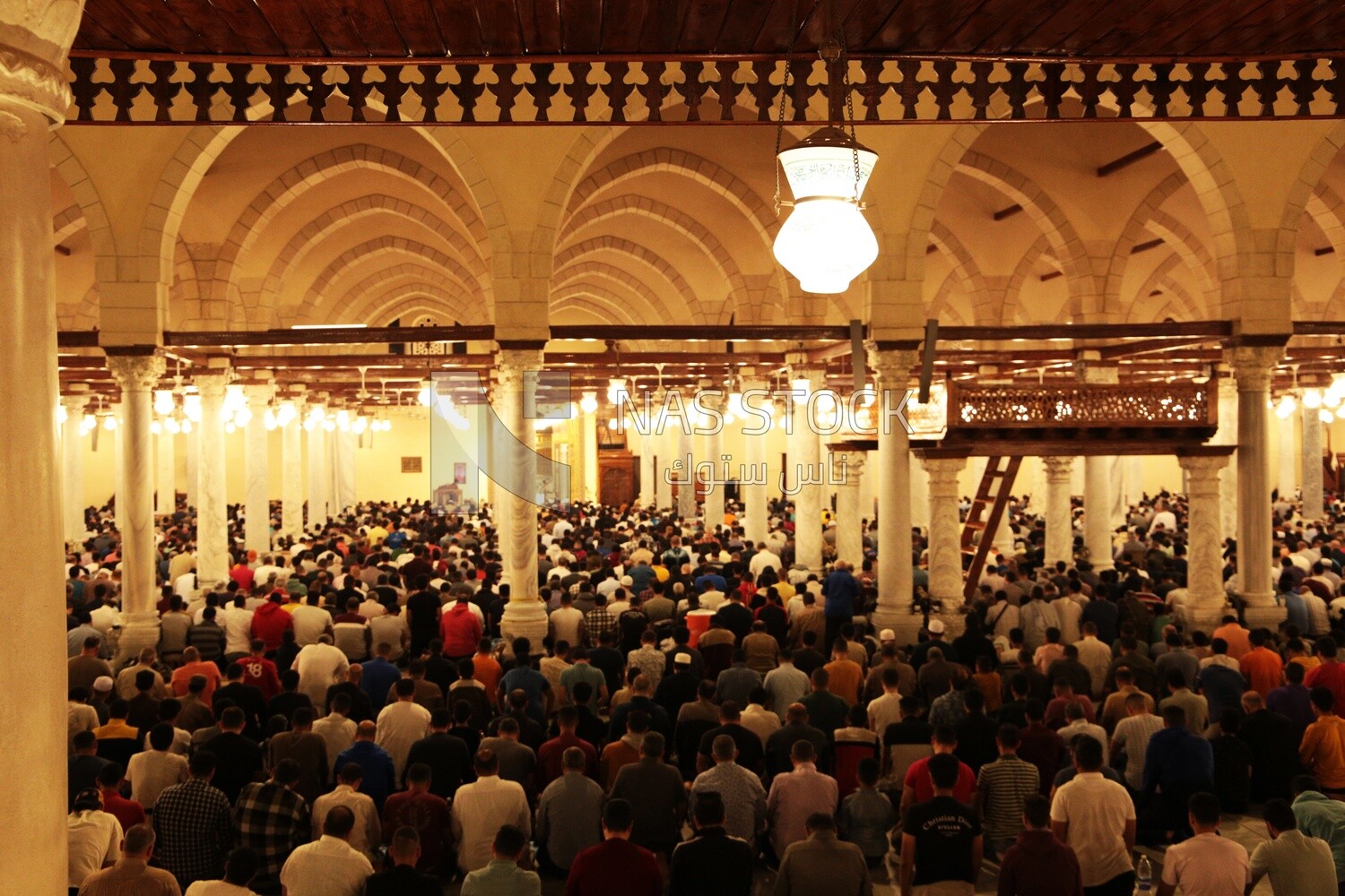 View from the back of the worshipers in the mosque, performing the obligatory prayer inside the mosque, reverence in prayer, performing the obligatory prayer in the mosque, worship and getting closer