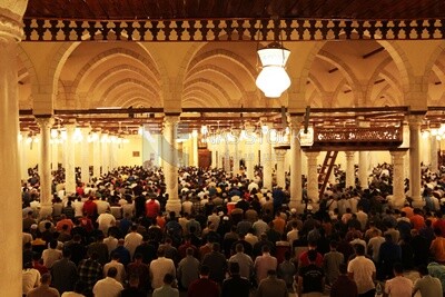 View from the back of the worshipers in the mosque, performing the obligatory prayer inside the mosque, reverence in prayer, performing the obligatory prayer in the mosque, worship and getting closer