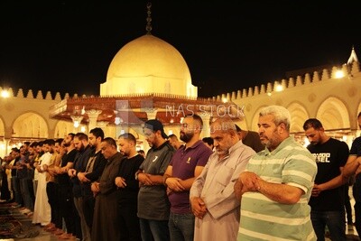 Worshipers praying in a mosque, performing the obligatory prayer in the mosque, worship and draw close to God