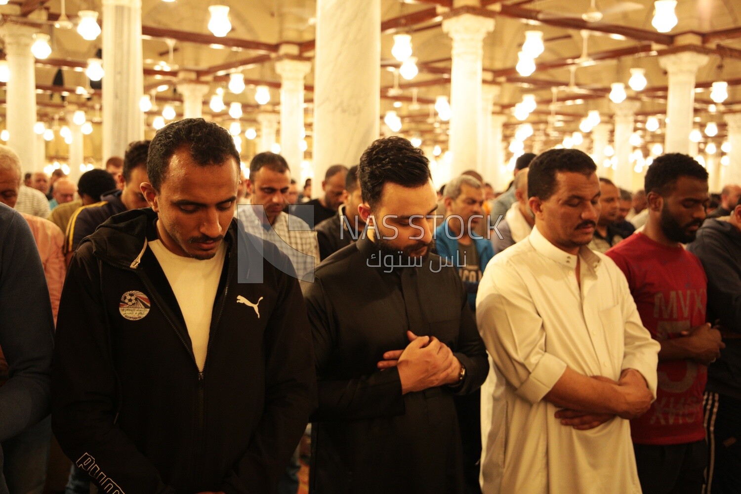 Worshipers praying in a mosque, performing the obligatory prayer in the mosque, worship and draw close to God