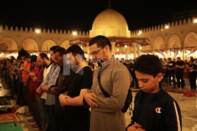 Worshipers praying in a mosque, performing the obligatory prayer in the mosque, worship and draw close to God