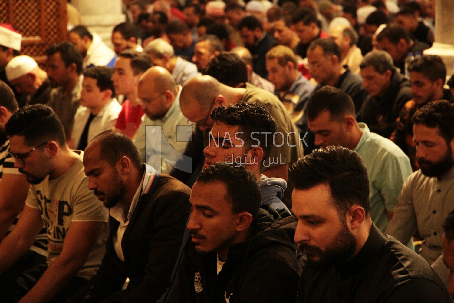 Worshipers praying in a mosque, performing the obligatory prayer in the mosque, worship and draw close to God