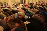 Worshipers praying in a mosque, performing the obligatory prayer in the mosque, worship and draw close to God