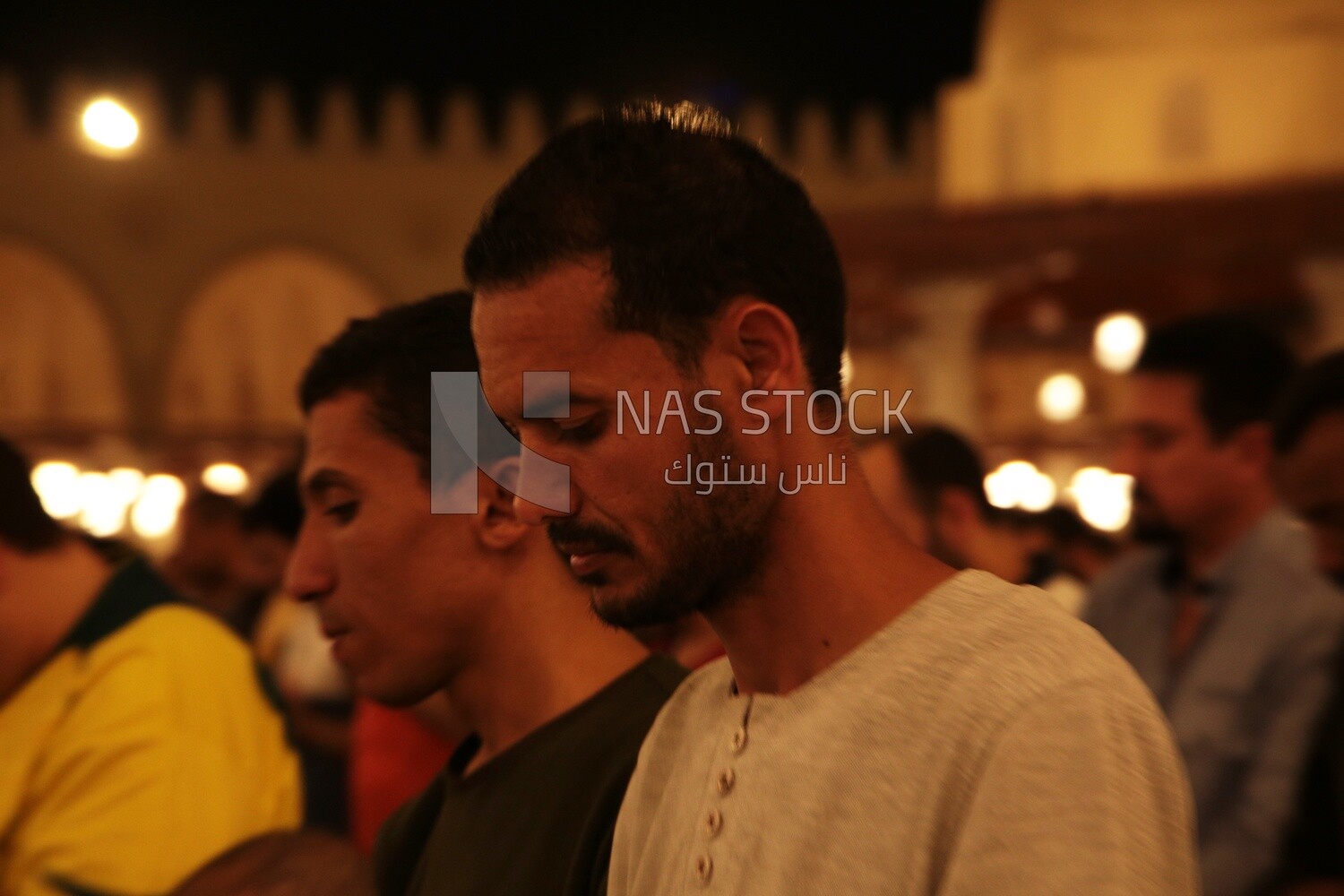 Worshipers praying in a mosque, performing the obligatory prayer in the mosque, worship and draw close to God