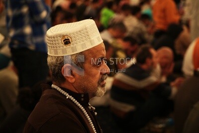 Man in the mosque, praying to God, praying on the prayer rug, performing the obligatory prayer in the mosque, worship and draw close to God