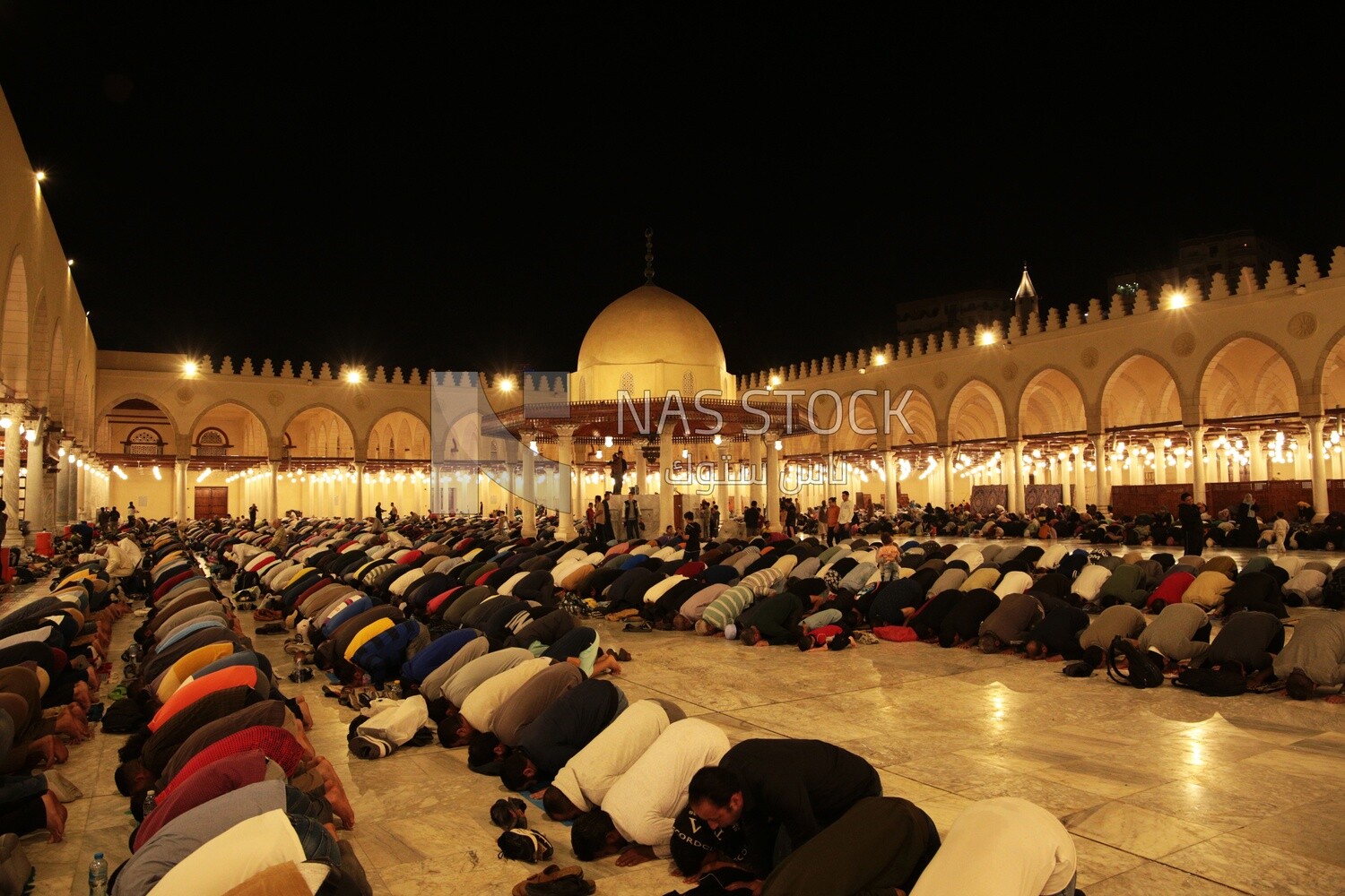 Worshipers praying in a mosque, performing the obligatory prayer in the mosque, worship and draw close to God