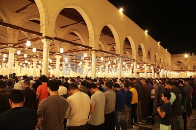 View from the back of the worshipers in the mosque, performing the obligatory prayer inside the mosque, reverence in prayer, performing the obligatory prayer in the mosque, worship and getting closer