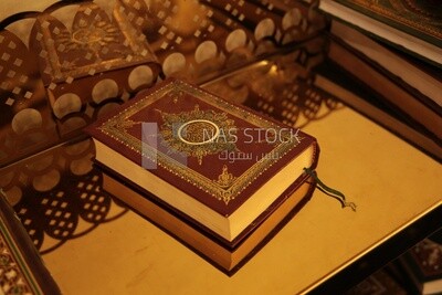 The Holy Qur’an on the table, reading the Holy Qur’an, Islamism and worship, reciting and memorizing the Holy Qur’an, mosque
