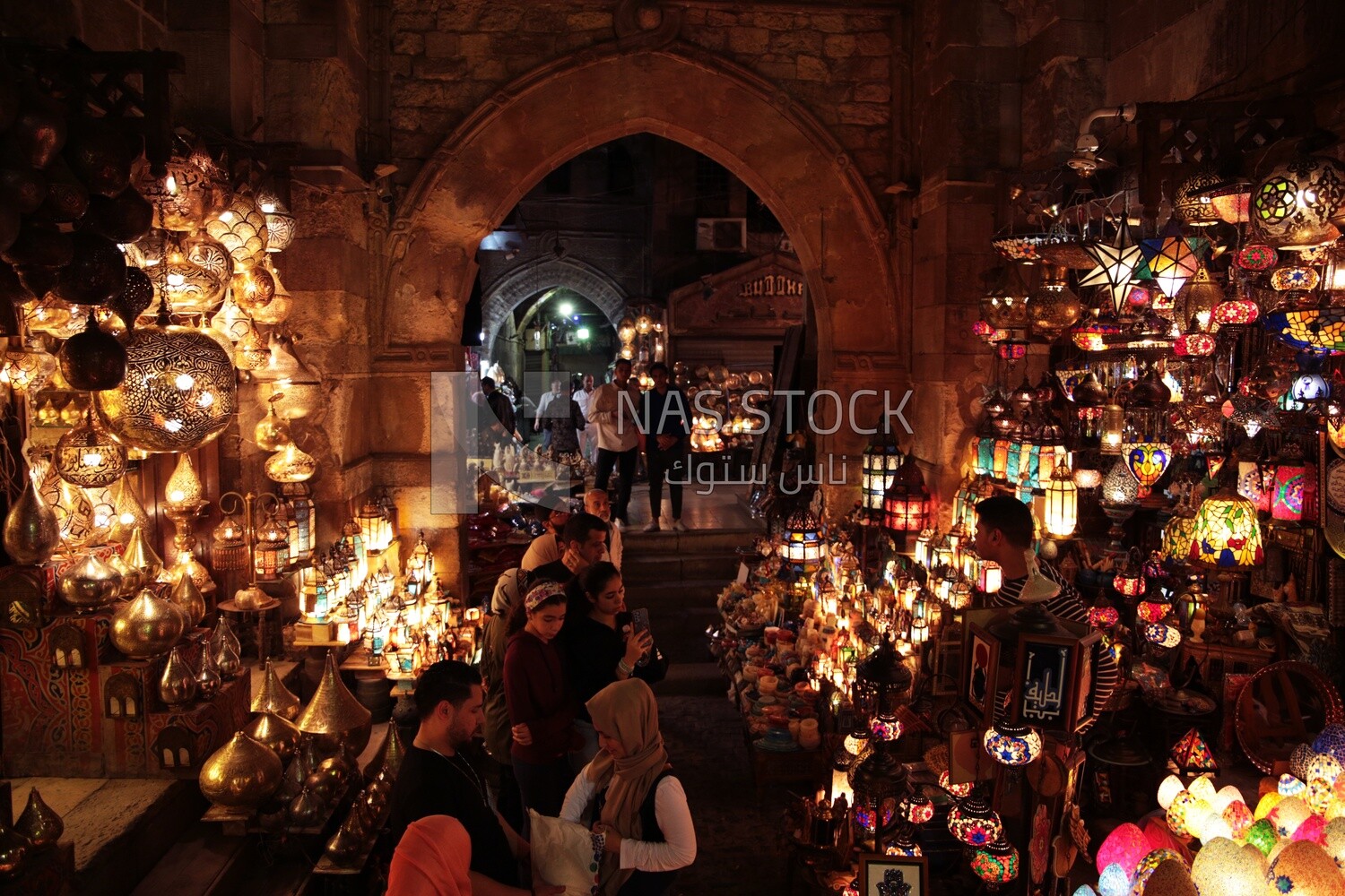 People on Al Moez Street at night, decoration lights