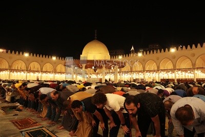 Worshipers praying in a mosque, performing the obligatory prayer in the mosque, worship and draw close to God
