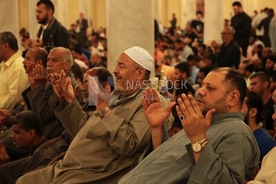 Worshipers praying in a mosque, performing the obligatory prayer in the mosque, worship and draw close to God