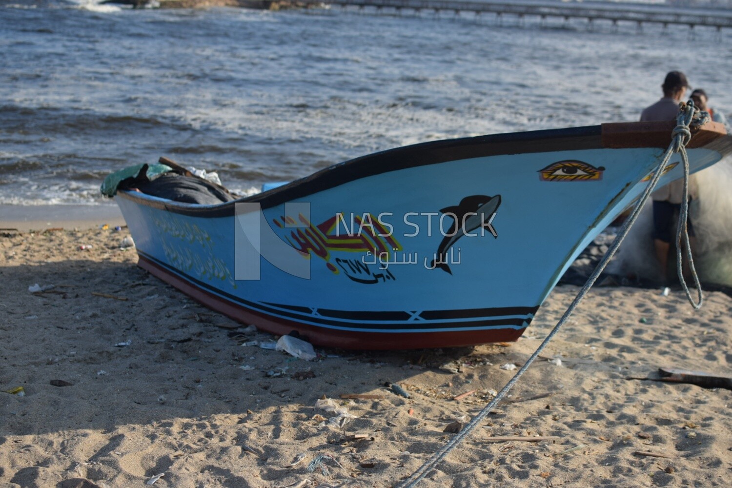 Fishing boat moored near the El Max lighthouse in the Alexandria Sea ,Egypt