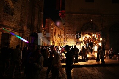 People on Al Moez Street at night, decoration lights