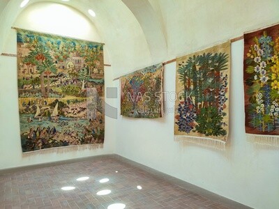 Group of wall carpets on display inside the Ramses Wissa Wassef Centre