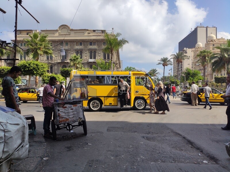 Crowded streets of Mansheya with transportation and citizens in Alexandria Egypt