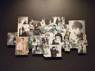 Some pictures of the Egyptian singer Om Kulthum hang on a wall in a museum named after her &quot;Om Kulthum Museum&quot; , Egypt